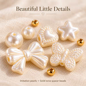 Close-up of shaped imitation pearl beads and gold-tone spacers